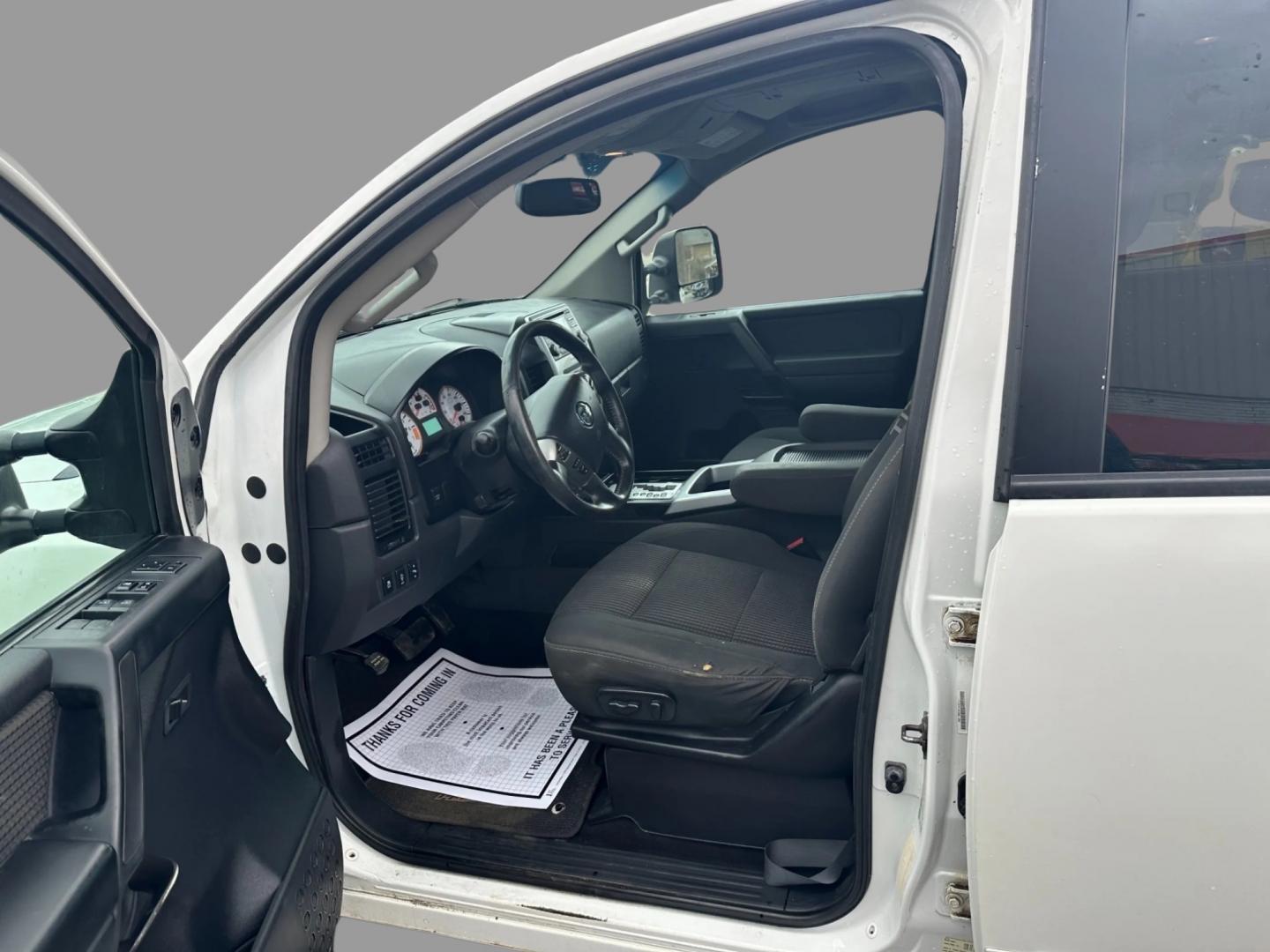 2013 White /Black Nissan Titan Pro-4X (1N6AA0EC0DN) with an 5.6L DOHC 32V V8 engine, Automatic transmission, located at 547 E. Main St., Orwell, OH, 44076, (440) 437-5893, 41.535435, -80.847855 - This 2013 Nissan Titan Pro-4X Crew Cab is a capable and well-equipped full-size pickup truck. It features a powerful 5.6L Endurance V8 engine paired with a 5-speed automatic transmission, a locking rear differential for improved traction, and a maximum towing capacity of 9,300 pounds. The truck is l - Photo#12